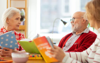 seniors reding books together